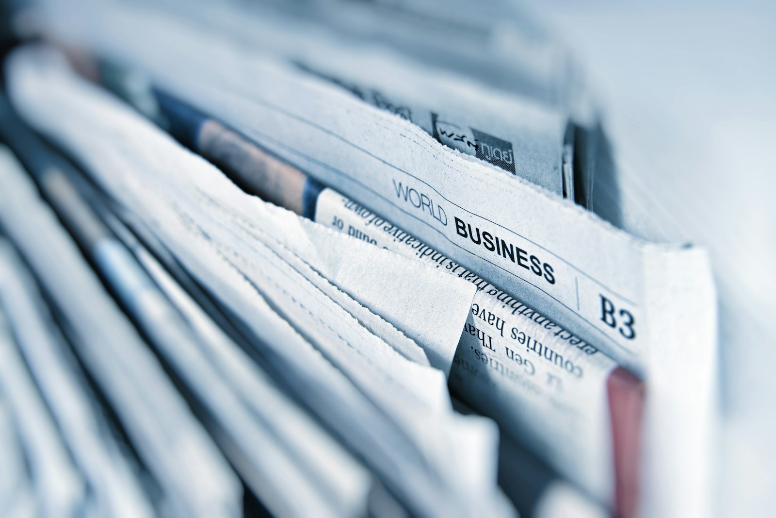 Newspapers spread across a table