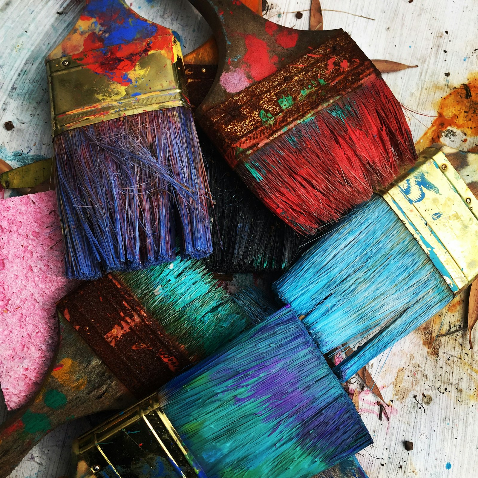 Paintbrushes and color on an artist’s table
